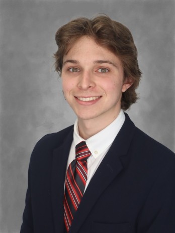 Image of Nicolas Hoeppel in a suit and tie